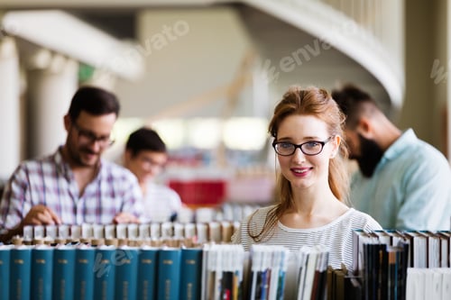 Preview: Group of college students studying at library