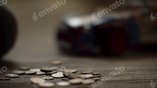 Preview: Close up for women hands putting money on the floor, saving money concept. Woman hands putting coins