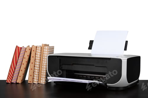 Preview: Printer and stack of books on black table against white background