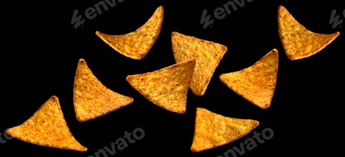 Preview: Falling corn chips, hot Mexican nachos isolated on black background