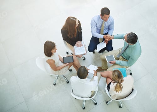 Preview: High angle shot of a group of businesspeople meeting in the office