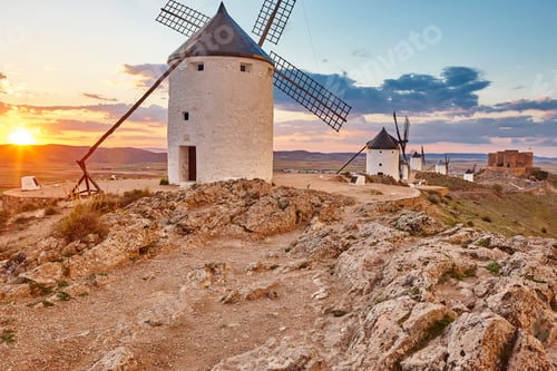 Preview: Traditional antique windmills at sunset in Spain. Consuegra, Toledo