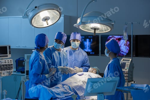 Preview: Surgeons team working with Monitoring of patient in surgical operating room.