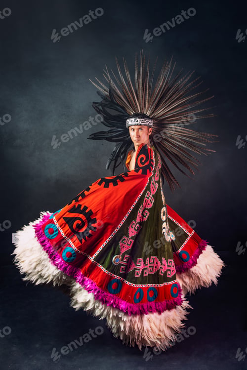 Preview: A woman in a colorful costume with feathers and a headdress