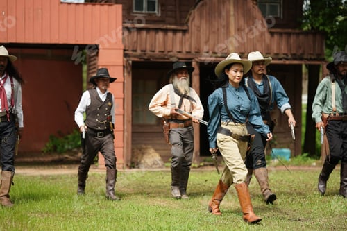Preview: Brutal cowboy with revolver, gunfight on ranch, rural background.