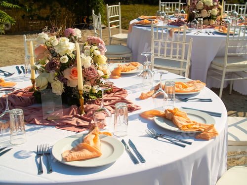 Preview: Beautiful outdoor wedding decoration in city. Candles and dried flowers and accessories with