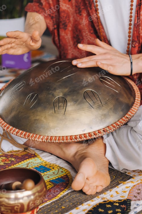 Preview: Close-up of a man's hand playing a modern musical instrument, the orion reed drum