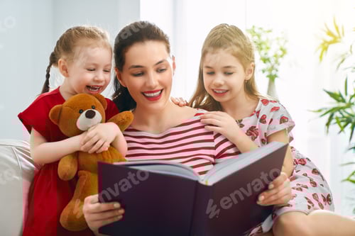 Preview: mother reading a book to daughters