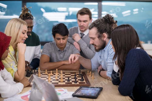 Preview: multiethnic group of business people playing chess