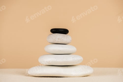 Preview: Zen stones on sand surface isolated on beige