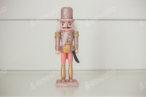 Preview: Pink and gold and silver sparkly Christmas nutcracker on white background