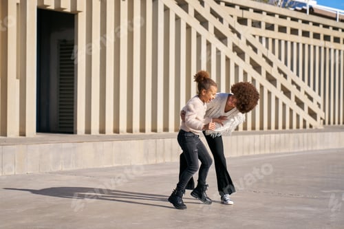 Preview: two latina sisters have fun playing tickle play on a sunny day