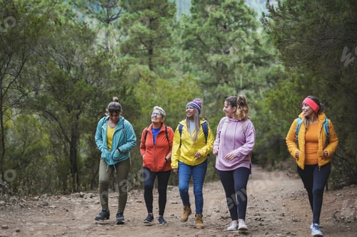 Preview: Multiracial women enjoy hiking day in nature - Multi generational female friends and sport concept