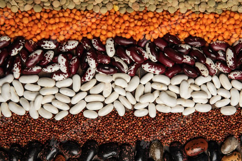 Preview: Different grains and seeds as background, top view. Veggie diet