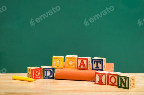 Preview: Colorful Education word wood block on orange book