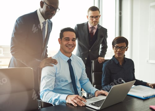 Preview: Group of four young business people in office