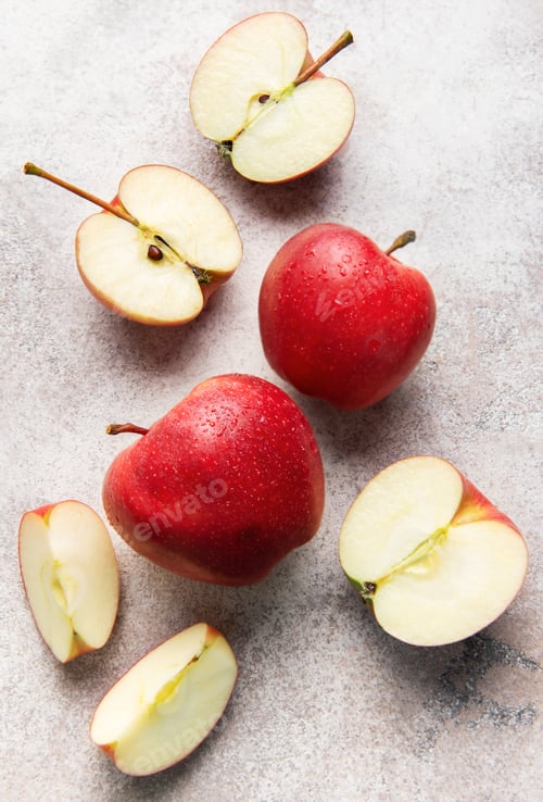 Preview: Ripe red apples whole and sliced fresh fruit