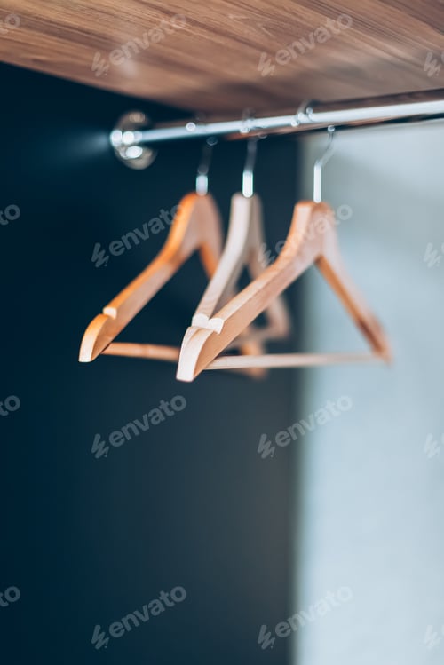 Preview: Wooden Hangers Hanging in a Closet, Clean Design