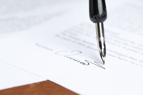 Preview: Signing notary document with fountain pen at brown table, closeup