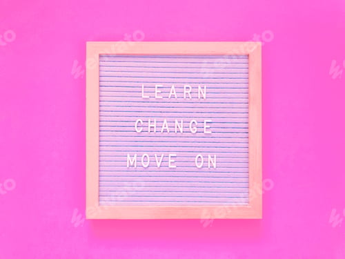 Motivational Words on a Sign Against Pink Background