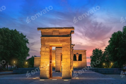 Preview: Illuminated Temple of Debod at sunset - ancient Egyptian temple at La Montana Park - Madrid, Spain