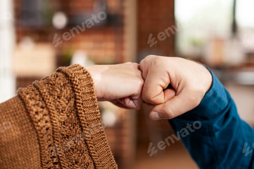Preview: Coworkers maintain safety with fist bump