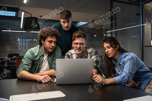 Preview: Programmers work alongside their colleagues in an office