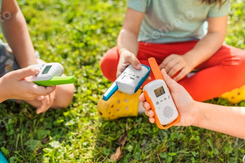 Preview: Small kids,girls play in walkie-talkie.Walkie Talkies with channels.Game of detectives, spies.Childr