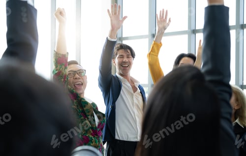 Preview: A group of people are smiling and waving at the camera. Scene is happy and celebratory