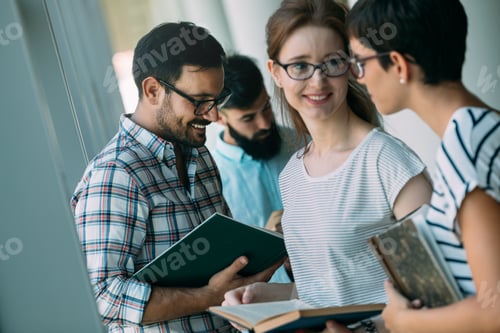 Preview: Group of Young Students Studying together at Library