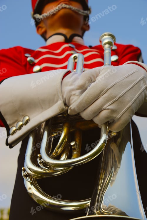 Preview: Minimalist image of musician in uniform holding baritone in drum and bugle corps competition