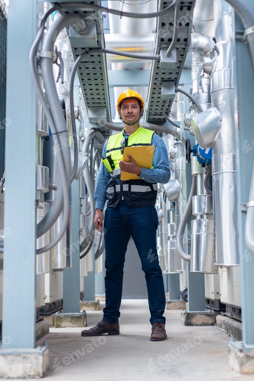 Preview: Engineer Standing Confidently in an Industrial Factory Setting