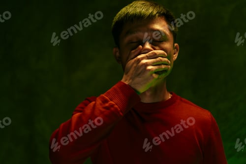 Preview: Chinese man covering his mouth and coughing. Coronavirus outbreak concept