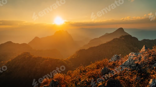 Preview: A sunset over the mountains; the beauty of the light against the rocky mountains