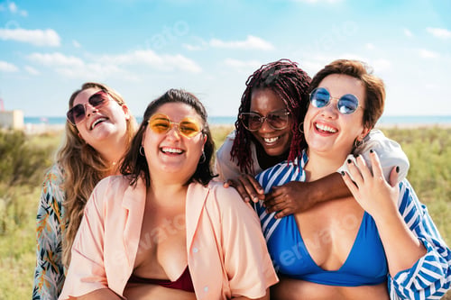 Preview: Group of plus size women with swimwear at the beach
