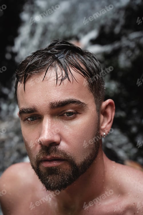 Preview: Closeup portrait of handsome bearded man with wet skin and hair