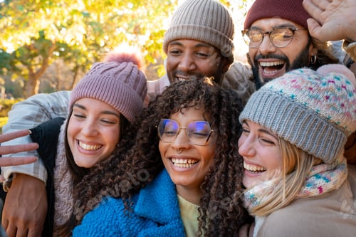 Preview: Cheerful group of friends taking selfie. Happy people having fun together outdoors.