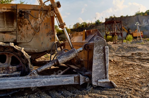 Preview: yellow excavator with a steering wheel digging out the ground summer sand truck