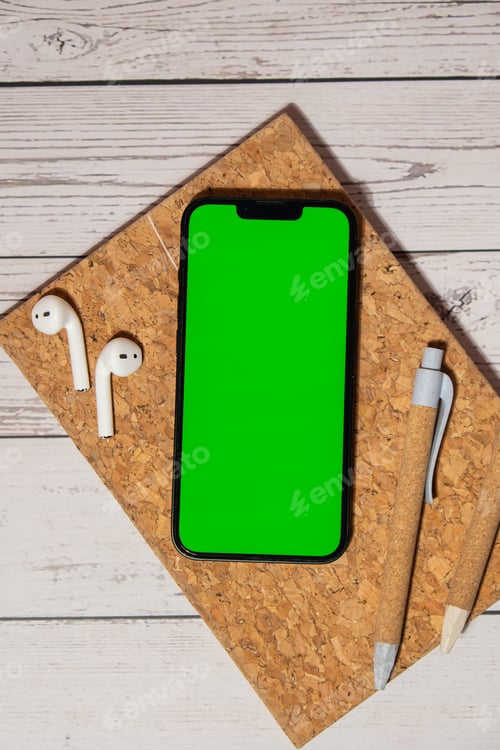 Preview: Top view, wooden Office desk mobile phone chroma key screen mock up mobile app application eco pen