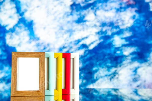 Preview: front view different picture frames with colored corners on the light-blue background color picture