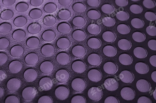Preview: Black metal computer case panel mesh with holes on purple background. Abstract close up