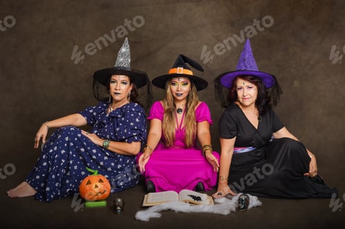 Preview: Studio portrait of three women of different ages dressed as witches.