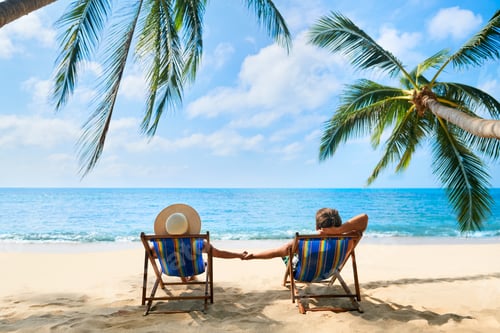 Preview: Couple relax on the beach enjoying beautiful sea on the tropical island