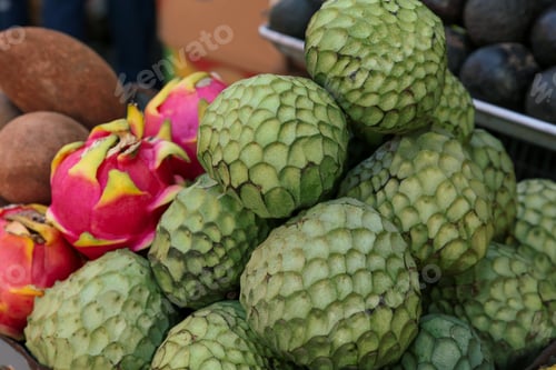 Preview: Cherimoya and dragon fruit at market, closeup