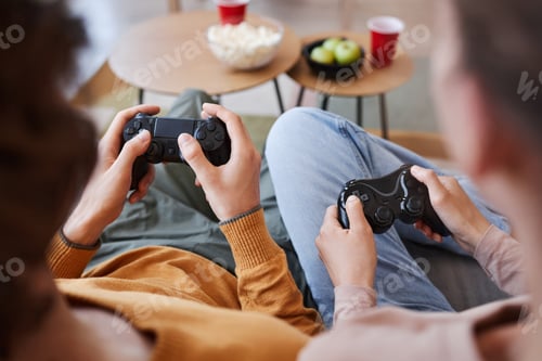 Preview: Young couple holding controllers