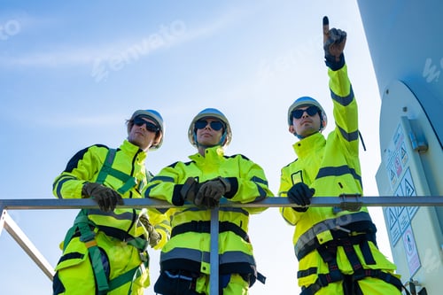 Preview: Confident engineers celebrating on platform