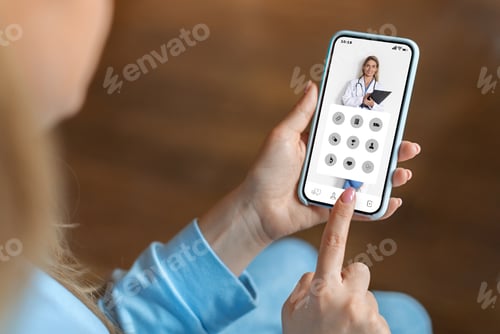 Preview: Young woman using medical app on smartphone at home