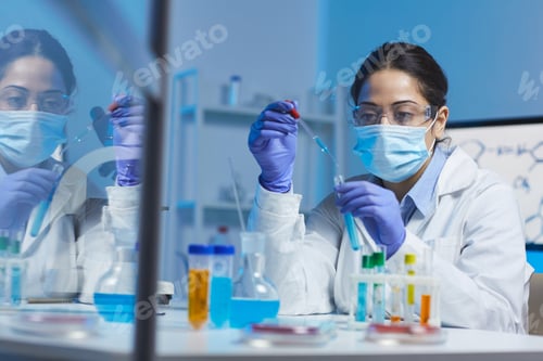 Preview: Concentrated female laboratory worker