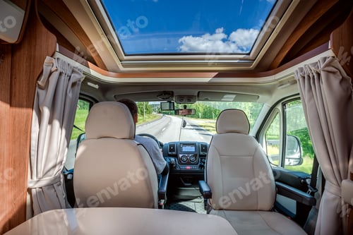 Preview: Man driving on a road in the Camper Van RV