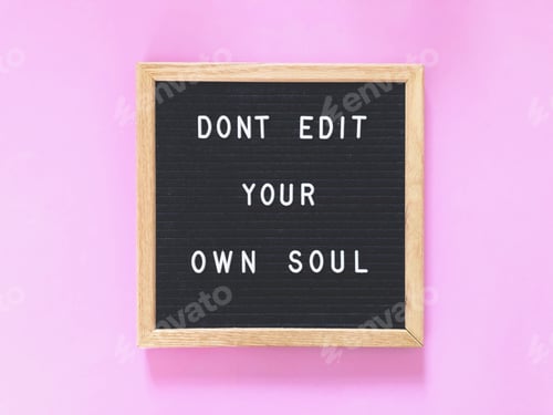 Inspirational Message on Letter Board Against Pink Background